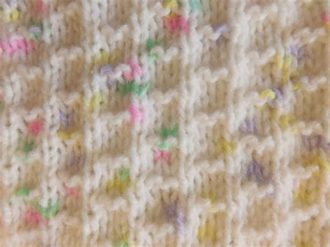 It is knitted all in one piece. Rainbow Sprinkle Knit Baby Blanket | AllFreeKnitting.com