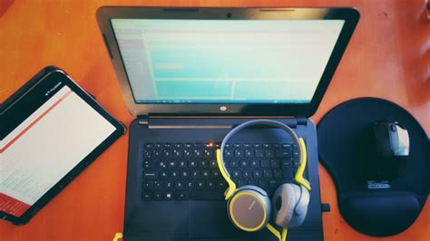 Picking a great home recording studio desk can be overwhelming, not to mention pretty expensive. Gray and Yellow Over-ear Headphones on Black Hp Laptop · Free Stock Photo