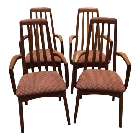 Couple very slight areas of fabric soiling and both captain chairs have some slight discoloring on the arms which should be visible in the listing pictures. Mid-Century Modern Benny Linden Teak Dining Chairs - Set of 4 | Chairish