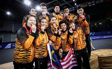 Badminton is often played as a casual outdoor activity in a yard or on a beach; The Gold Moment for Malaysia Badminton Team at The Glasgow ...