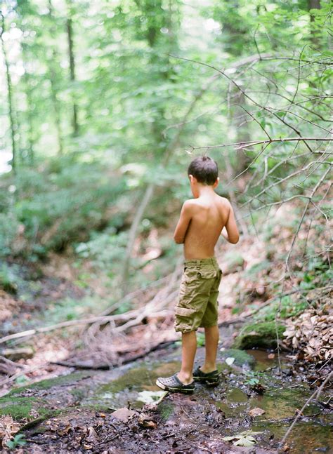 Young Boy Exploring In The Woods by Marta Locklear