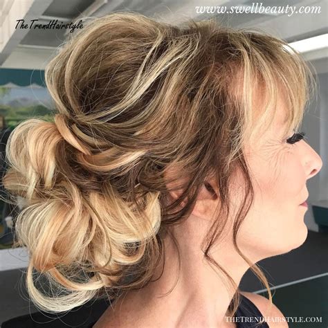 It would take very little to style this do if you were in a the across the forehead bang has always been in style. Messy Bun with Romantic Strands - 40 Contemporary and ...