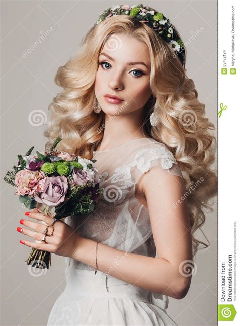 It looks like it requires some serious effort, but in reality, you only need to spend two minutes max raking a um, forget everything you know about hair accessorizes, 'cause this long, curly hairstyle is definitely the prettiest approach. Portrait Of A Beautiful Young Blonde Woman With Long Curly ...