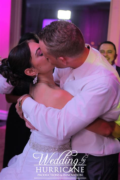 A second wedding photographer is helpful when the couple is getting ready in two separate locations. Bride and groom share a kiss after their first dance as a married couple at Waterside NJ ...