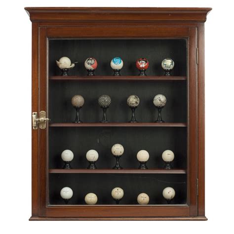 It is not as deep as that initial case and all told it holds approximately 180 golf balls and is getting shipped to okc in a couple of weeks. Golf Ball Display Cabinet at 1stdibs