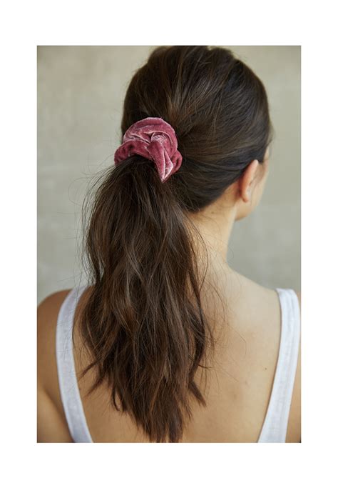 All you have to do is take a section of hair in the front on each side and twist them until the ends meet in the center. Five Easy Hairstyles For Summer - maed