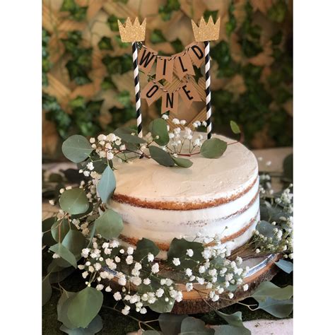 Birthday cakes are often layer cakes with frosting served with small lit candles on top representing the celebrant's age. Pin on Wild One 1st Birthday