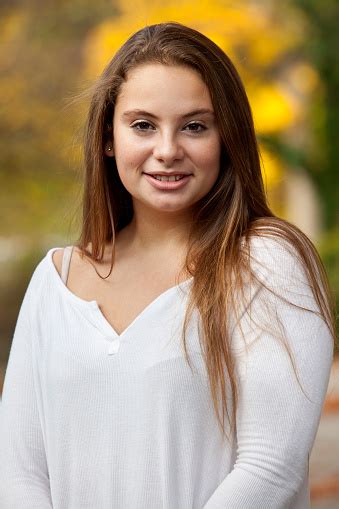 Long dark waves with silver highlights. Teen Girl In White Smiling With Long Highlighted Hair ...