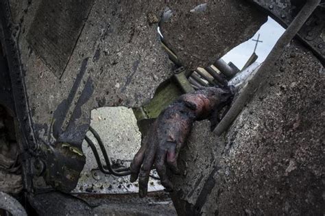 This post includes graphic photos that may be disturbing. SURREAL PICS: MH17 Crash Site