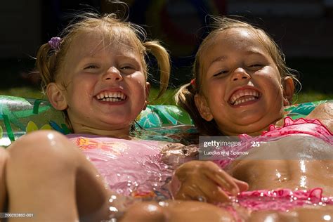 Voyeur videos selected girls dress up for a hidden camera (pages: Two Girls Lying In Paddling Pool Laughing High-Res Stock ...