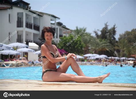 Pool, gloves, posing, teasing, rita, see through. Beautiful Mature Woman Posing Camera Turquoise Water ...