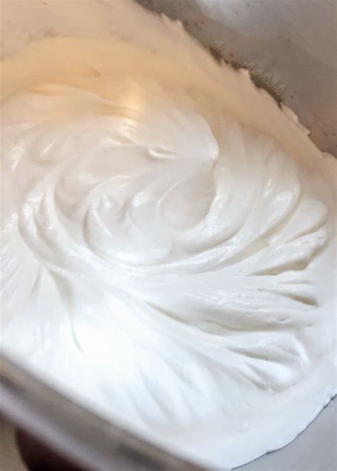 Place a metal mixing bowl and metal whisk into the freezer for 10 to 15 minutes. Whipped Cream Cheese Frosting Recipe | My Cake School