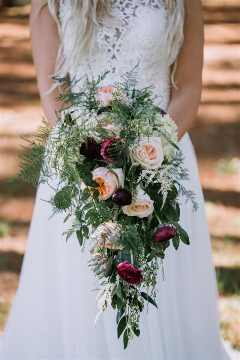 How do you find out what kind (and colors) of flowers are in season during your wedding month? Image result for foliage wedding bouquet purple and ivory ...