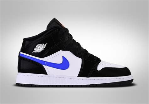 Coming in a classic white and university blue colorway. NIKE AIR JORDAN 1 RETRO MID GS BLACK RACER BLUE WHITE ...