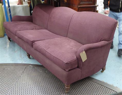 Cushion, with bug, aubergine coloured. KINGCOME SOFA, Howard triple hump style, in aubergine ...