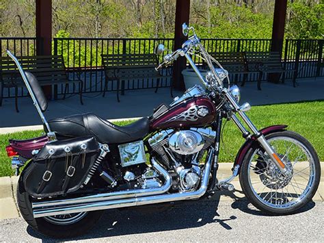 Chromed sissy bar and backrest; 2005 Dyna with 16 inch HCC chrome Apes Prewired Plug ...