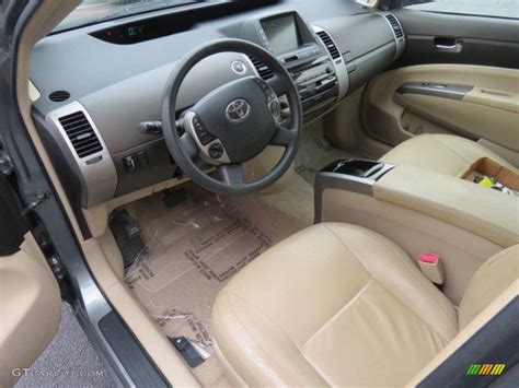 Dashboard icons are displayed in a variety of colors, depending on the system and its status in a specific vehicle. Ivory/Brown Interior 2005 Toyota Prius Hybrid Photo #68582633 | GTCarLot.com