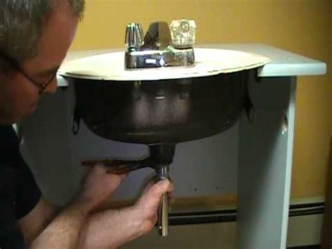 How to install a bathroom sink popup drain stopper. Old plumber shows how to install a drain on a bathroom ...