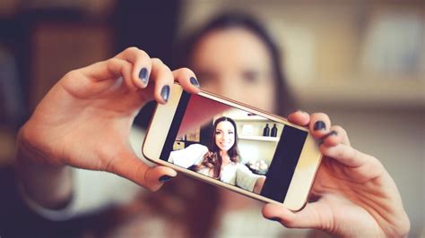 The program snaps a picture on her. Use these 5 apps to take the Best Selfies