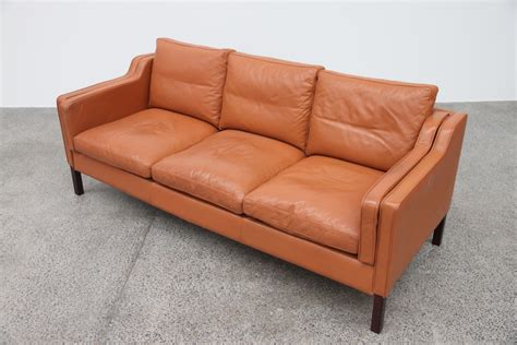 The classic design and style of leather sofas are a great choice for your living room. Tan Leather Sofa - The Vintage Shop