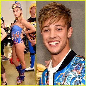 Takes a pounding from two guys. Cameron Dallas Watches Hailey Baldwin Walk in Moschino ...