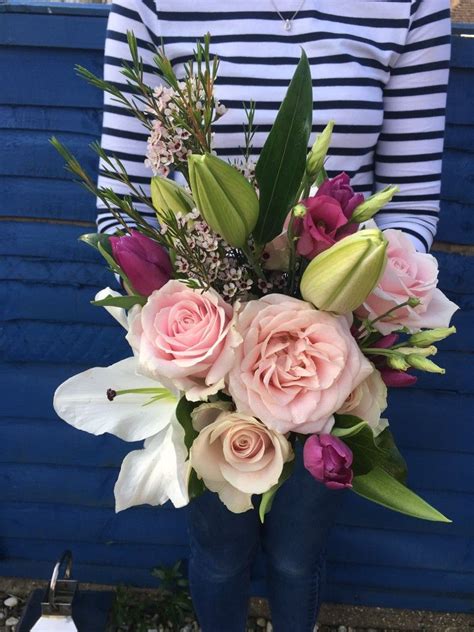 Wedding bouquet, bridal bouquet, beautiful bouquet of different colors. A wedding bouquet of Lilly, rose, wax flower and tulips. # ...