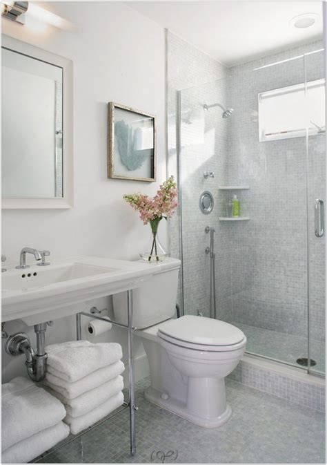 This small and simple bathroom has gray upper walls paired with redwood wainscoting that puts emphasis on the light gray thin cabinet, toilet and countertop of the dark wood vanity with an elegant brass faucet. Beach House Bathroom Traditional Apinfectologia for small beach house bathroom design ideas wit ...