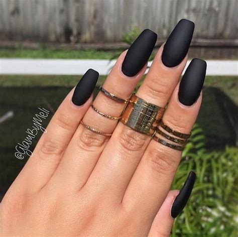 The blue matte color in the index and the ring finger designed with a single black decal, in addition to the thumbnail decorated with silver glitter at the bottom that l0oks like snow falling on the nail, the middle, fingernail made up of a black base and white decals and the pinky finger covered with silver shiny shimmer all make up the perfect black. 60 Pretty Matte Nail Designs | Styletic