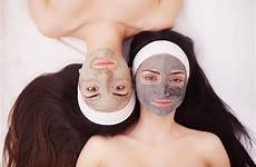 two mask relaxing facial spa application girls during stock