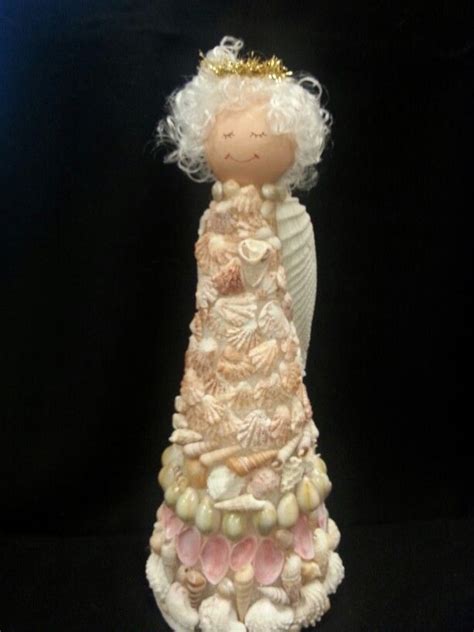 They can paint the egg shells and crush them when dried and use them to decorate other crafts such as a christmas ornament, a jewelry box or a greeting card. Handcrafted sea shell angel | Seashell crafts, Shell ...