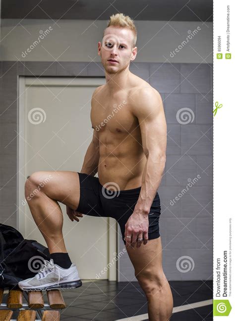 See more ideas about muscle, locker room, muscle men. Athlete In Locker Room Tying Sneakers, Shirtless, Looking ...