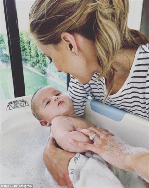 In most situations, a fussy baby means one thing: Rebecca Judd bathes four-month-old son Tom | Baby bath ...