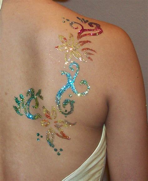 The most popular designs today come from the maori and polynesian cultures. Colorful and Glittery Shoulder Blade Tribal Tattoos for Women