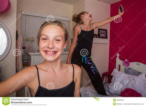 Maybe you would like to learn more about one of these? Two Young Girls Playing In Their Room Stock Photo - Image ...