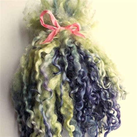 This necklace is handwoven using a variety of recycled fibers to create a new wearable piece of art! Wensleydale wool locks, separated, spinning fiber, tailspinning, weaving, felting, dolls hair ...