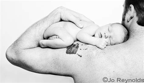 This sentimental parent tattoo shows a detailed line drawing of a mother and her baby. My Tattoo Designs: Baby Handprint Tattoos