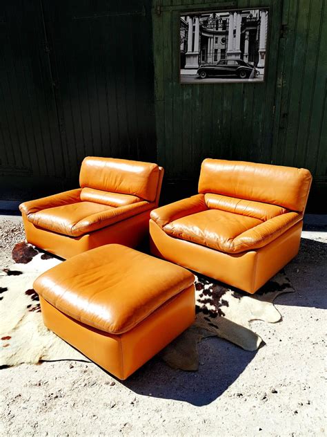 A leather chair ottoman adds more than style. Pair of Tan Leather Lounge Chairs with Ottoman by Anita ...