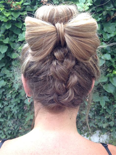 A stacked bob works great with curly hair, but on days when you want to change things up or keep hair out of your eyes, braiding is the easiest way to go. Upside down Dutch braid into a bun, added a little bow as well #hair #braids | Pretty hairstyles ...