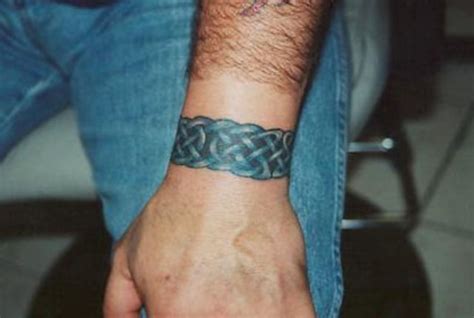 Black celtic tattoo on wrist. 25 Awesome Small Wrist Tattoo Ideas For Men - Styleoholic
