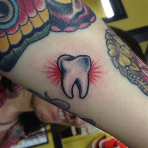 The cap is then fixed on to the surface o the tooth. Tooth tattoo, Traditional tattoo tooth, Traditional tattoo