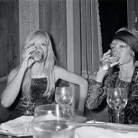 1970. Brigitte Bardot and Sylvie Vartan drinking a glass ...