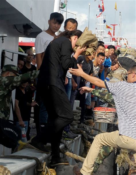 Stacked wifey shares hubby with coed. Residents navigate a flooded street in Lingao, Hainan ...