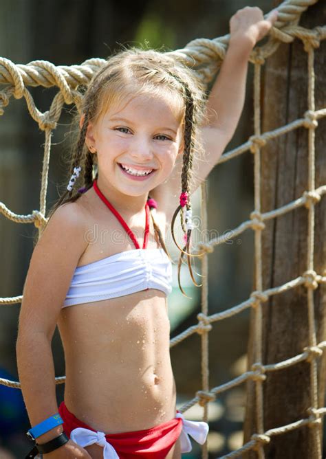 What do all these girls have in common? Little girl at aquapark stock photo. Image of amusement ...