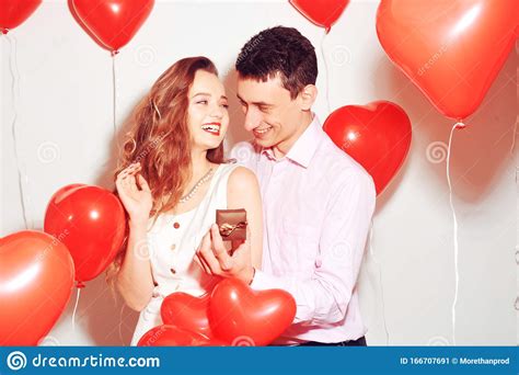 Man Makes Present To His Lovely Sweetheart Girl. Lover`s Valentine Day ...