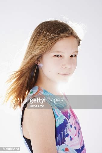 Dressed in pink dress in studio on white background. Portrait Of Beautiful 12 Year Old Girl Stock Photo | Getty ...