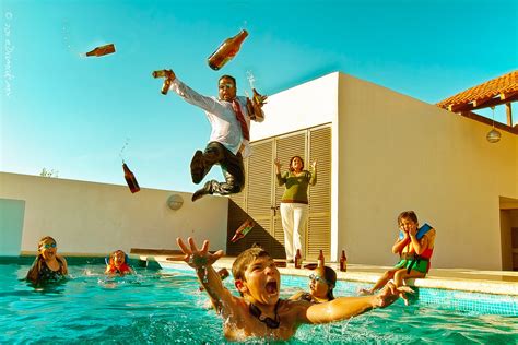 Several boys and girls are playing at a pool in their swimming suits. The Pool Party Takeover | An underwater photography Sunday ...