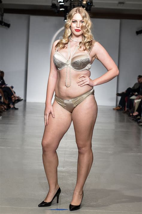 The model, 23, looked sizzling in a matching bright pink lace bra and panties lingerie set that perfectly displayed her enviable hourglass figure. runway lingerie model