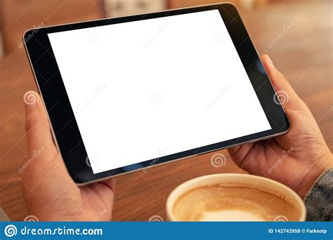 The stretched display makes the screen appear pixilated as the screen is stretched to match the resolution and size of the monitor. Tablet Pc With Blank White Screen Horizontally With Coffee ...