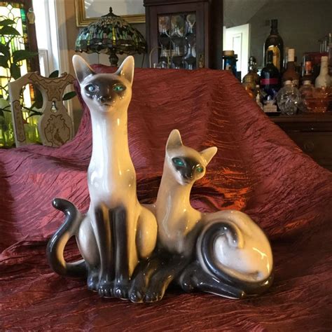 There were numerous cat tv lamps produced, primarily siamese cats, which were extremely popular in the 1950s. Mid-Century Siamese Cat Lamp | Chairish