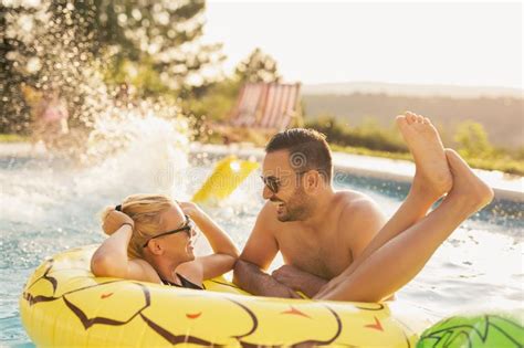 Facebook gives people the power to share and makes the world. Romance by the pool stock photo. Image of enjoying ...